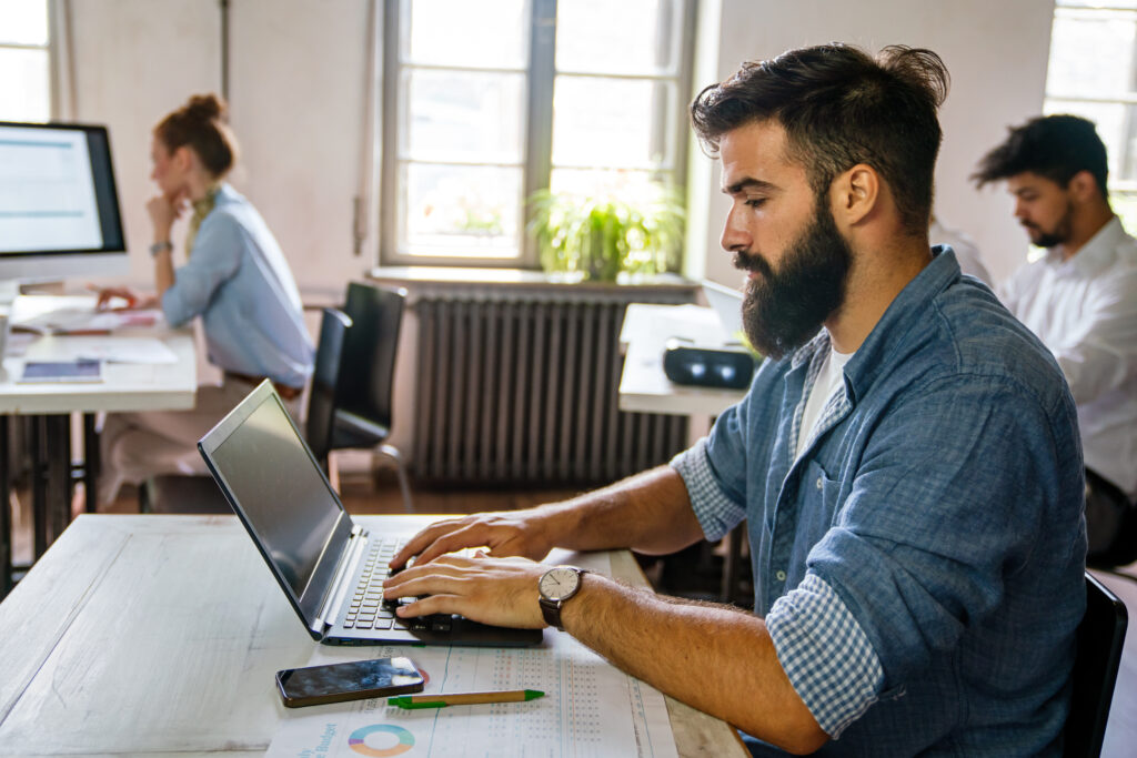 Programmers working in a software developing company office. Business people as a team