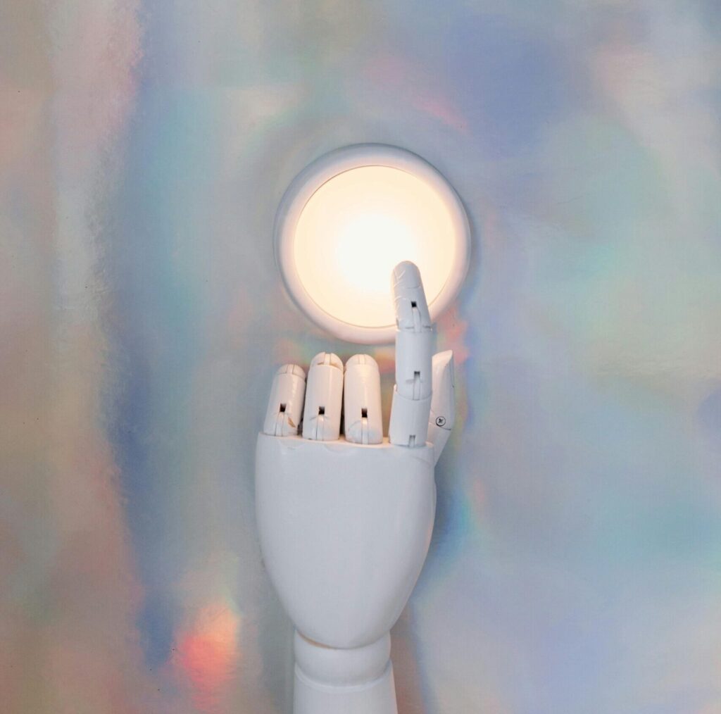 Robot finger triggering a light—representing how to spawn new tickets in ConnectWise through automation