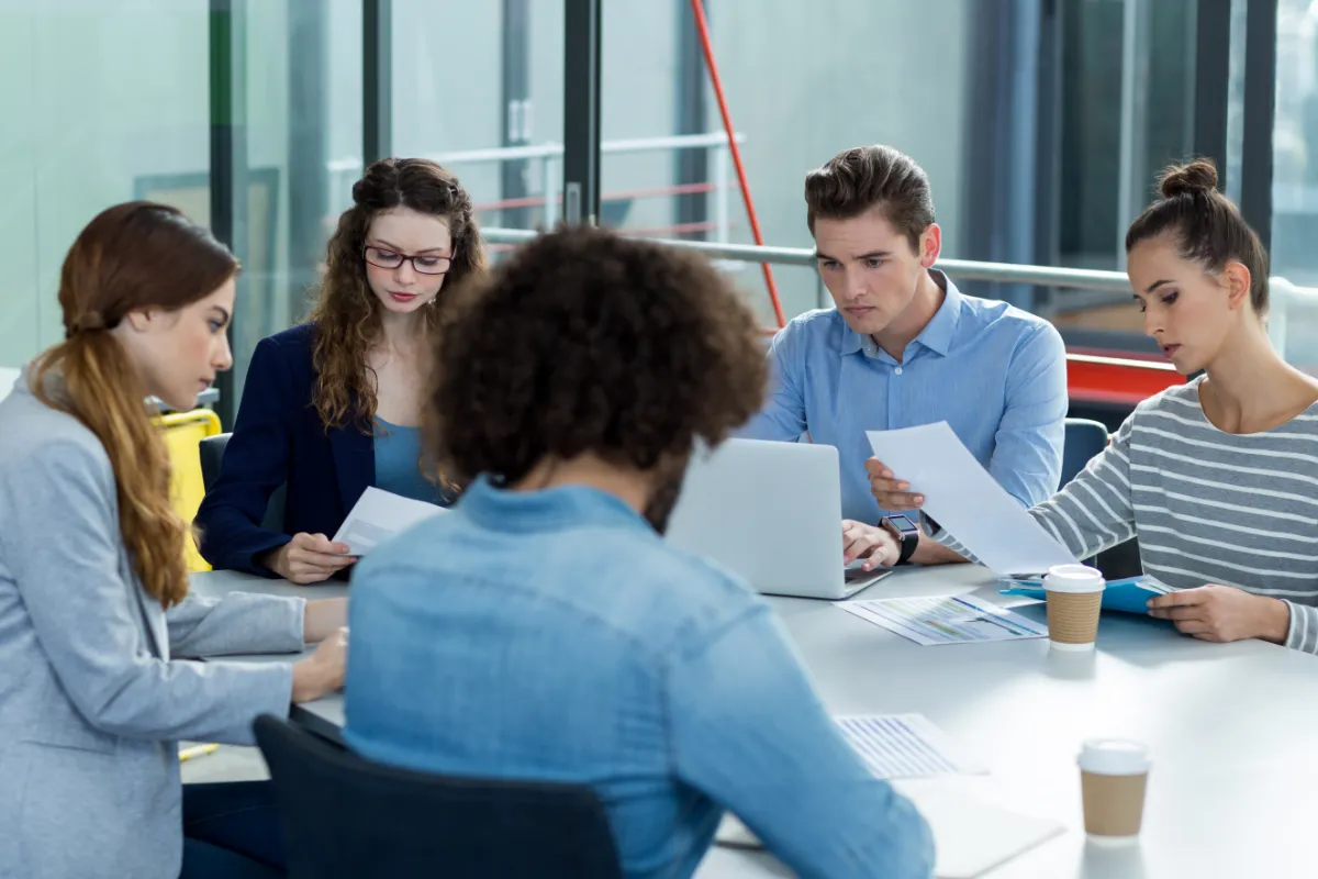 Business team having training meeting around table together