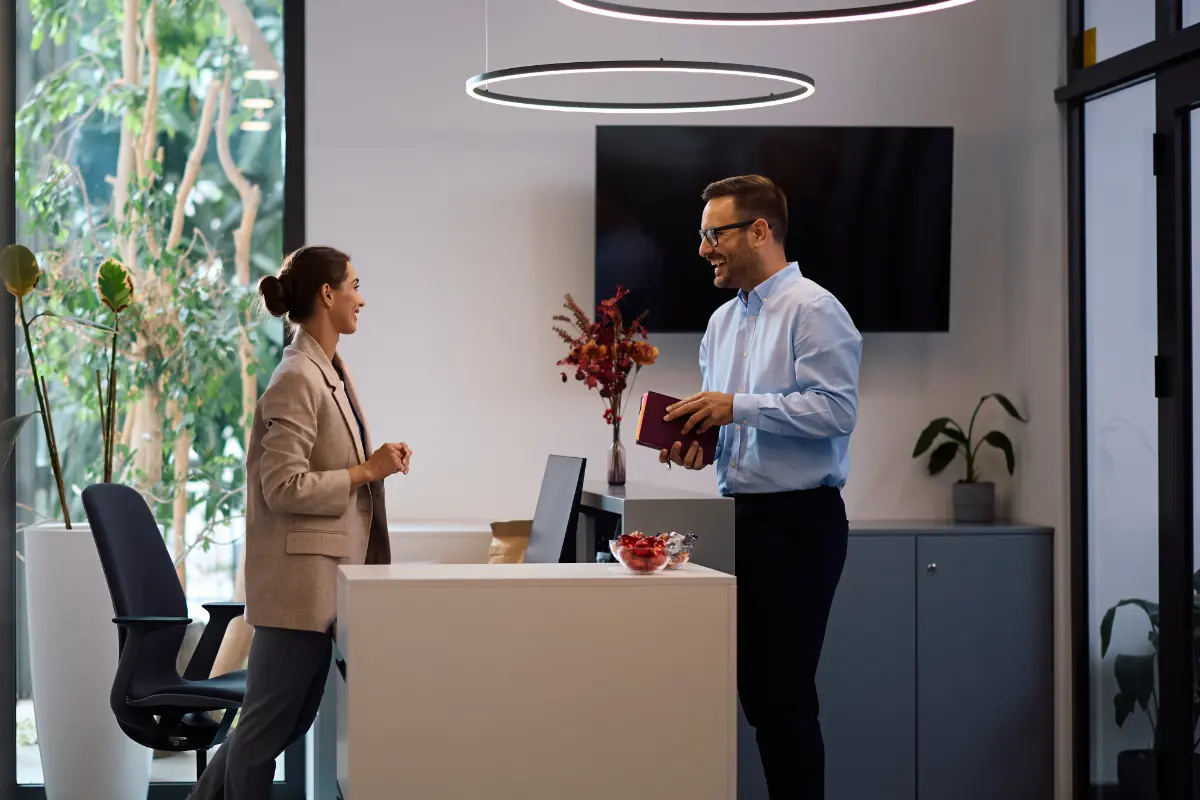 Happy business colleagues talking while working in the office